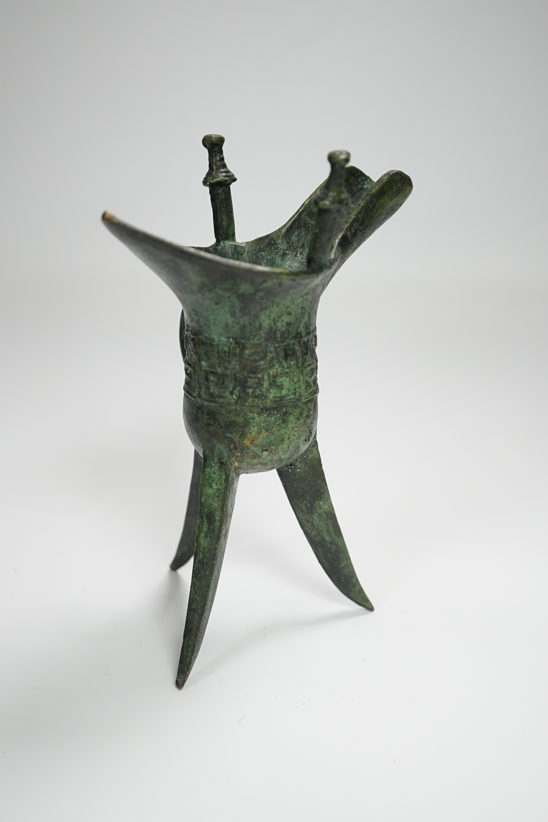 A Chinese bronze archaistic tripod Jue cup (ex. late prof. R.M. Hicks OBE), 18cm